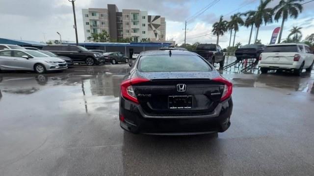 2016 Black Honda Civic Sedan (2HGFC1F92GH) with an 4 1.5 L engine, Variable transmission, located at 27610 S Dixie Hwy, Homestead, FL, 33032, (305) 749-2348, 25.510241, -80.438301 - IIHS Top Safety Pick+. Boasts 42 Highway MPG and 31 City MPG! This Honda Civic Sedan boasts a Intercooled Turbo Regular Unleaded I-4 1.5 L/91 engine powering this Variable transmission. Wireless Phone Connectivity, Wheels: 17 Alloy, Wheels w/Machined w/Painted Accents Accents.*This Honda Civic Sedan- Photo#2