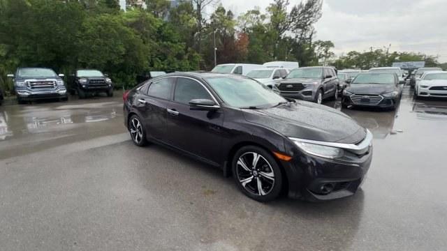 2016 Black Honda Civic Sedan (2HGFC1F92GH) with an 4 1.5 L engine, Variable transmission, located at 27610 S Dixie Hwy, Homestead, FL, 33032, (305) 749-2348, 25.510241, -80.438301 - IIHS Top Safety Pick+. Boasts 42 Highway MPG and 31 City MPG! This Honda Civic Sedan boasts a Intercooled Turbo Regular Unleaded I-4 1.5 L/91 engine powering this Variable transmission. Wireless Phone Connectivity, Wheels: 17 Alloy, Wheels w/Machined w/Painted Accents Accents.*This Honda Civic Sedan- Photo#6