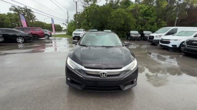2016 Black Honda Civic Sedan (2HGFC1F92GH) with an 4 1.5 L engine, Variable transmission, located at 27610 S Dixie Hwy, Homestead, FL, 33032, (305) 749-2348, 25.510241, -80.438301 - IIHS Top Safety Pick+. Boasts 42 Highway MPG and 31 City MPG! This Honda Civic Sedan boasts a Intercooled Turbo Regular Unleaded I-4 1.5 L/91 engine powering this Variable transmission. Wireless Phone Connectivity, Wheels: 17 Alloy, Wheels w/Machined w/Painted Accents Accents.*This Honda Civic Sedan- Photo#7