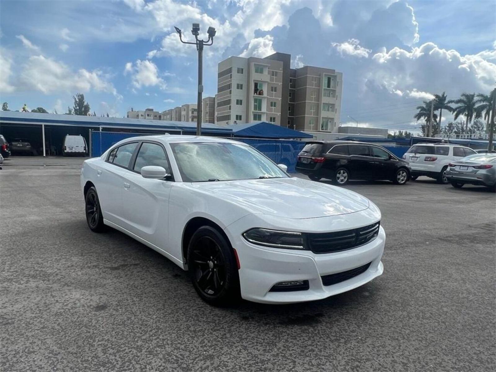 2016 Bright White Clearcoat /Black Dodge Charger SXT (2C3CDXHG8GH) with an 3.6L 6-Cylinder SMPI DOHC engine, Automatic transmission, located at 27610 S Dixie Hwy, Homestead, FL, 33032, (305) 749-2348, 25.510241, -80.438301 - Photo #0