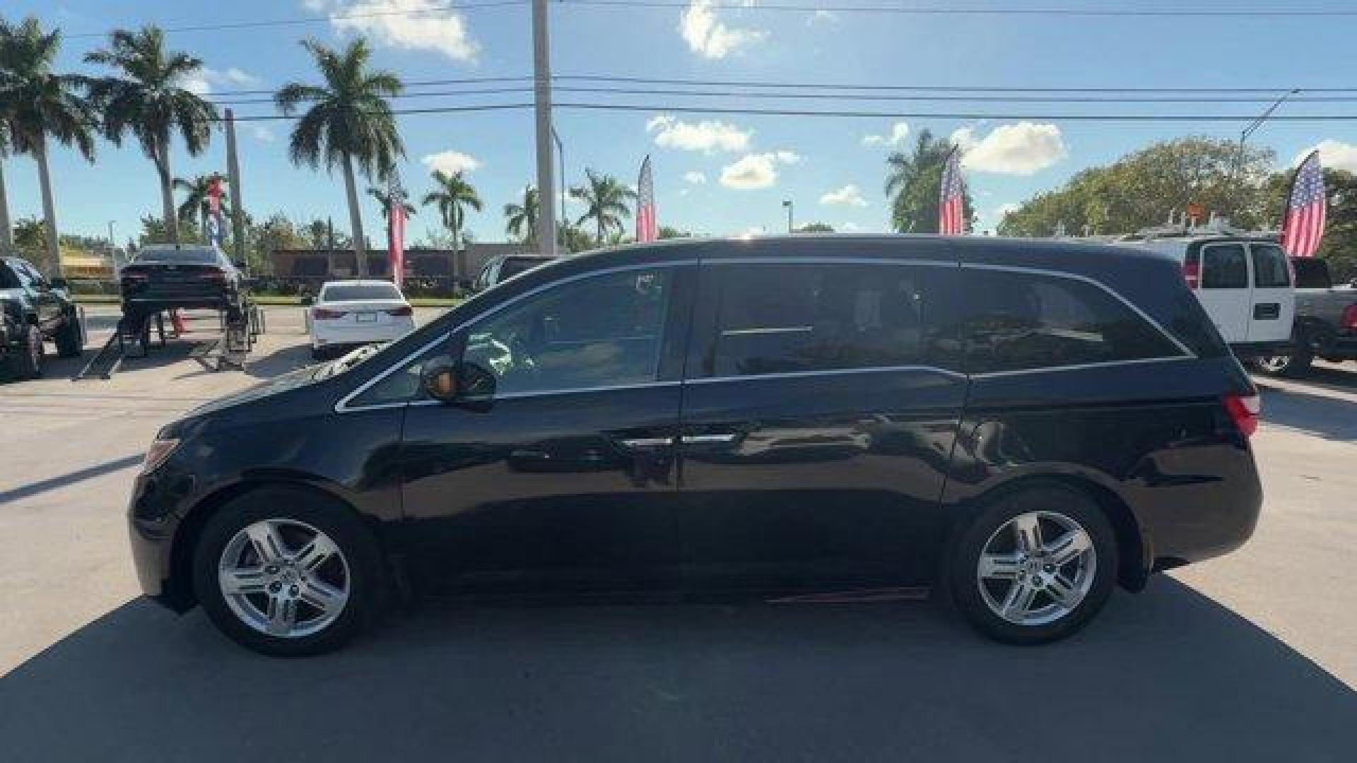 2013 Black Honda Odyssey (5FNRL5H97DB) with an 6 3.5L engine, Automatic transmission, located at 27610 S Dixie Hwy, Homestead, FL, 33032, (305) 749-2348, 25.510241, -80.438301 - KBB.com 10 Best Family Cars. Only 119,824 Miles! Boasts 28 Highway MPG and 19 City MPG! This Honda Odyssey boasts a Gas V6 3.5L/212 engine powering this Automatic transmission. XM Radio (subscription required), Wide-mode adjustable 2nd-row seats -inc: leather trimmed outboard seats, multi-function c - Photo#1