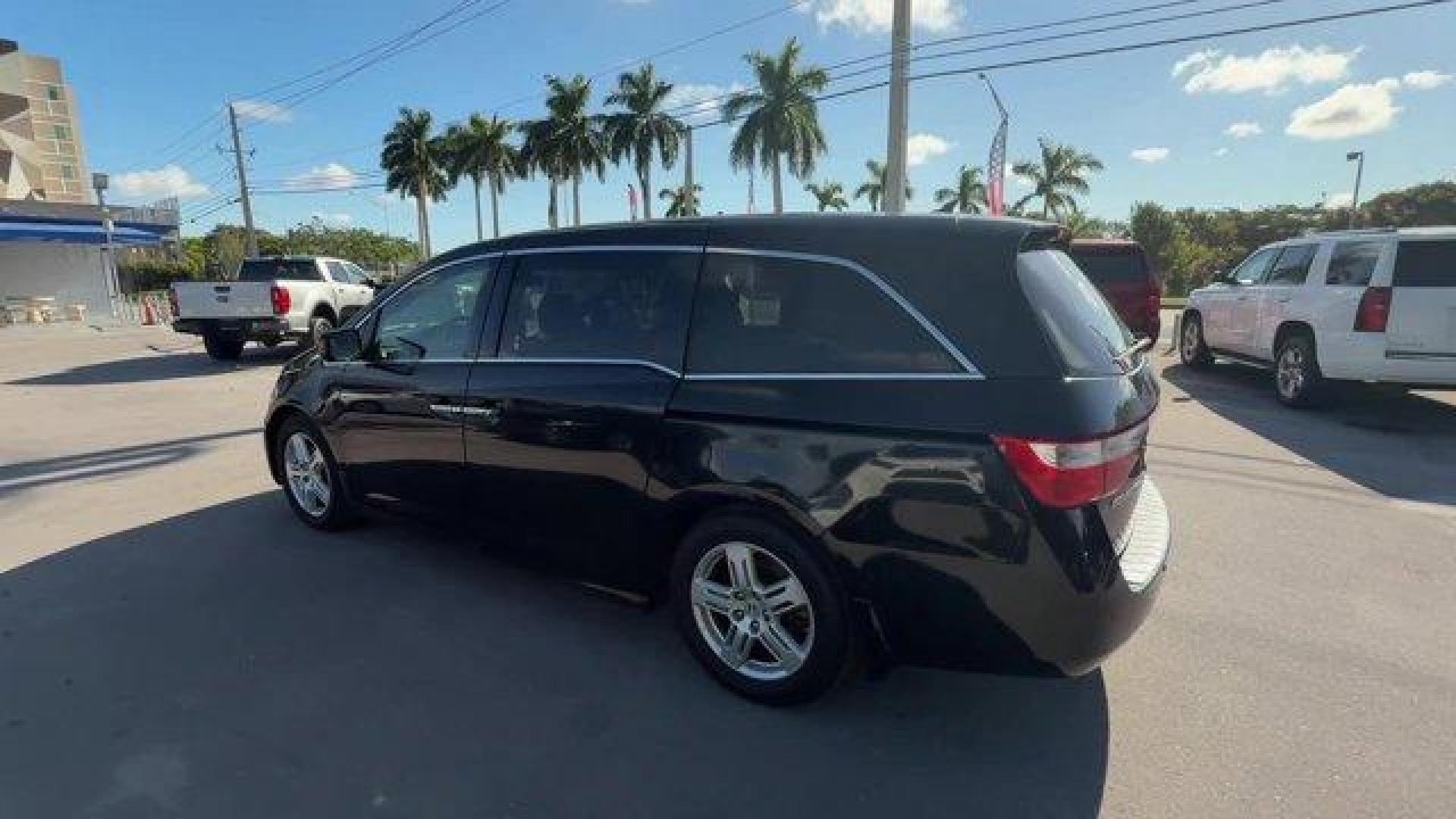 2013 Black Honda Odyssey (5FNRL5H97DB) with an 6 3.5L engine, Automatic transmission, located at 27610 S Dixie Hwy, Homestead, FL, 33032, (305) 749-2348, 25.510241, -80.438301 - KBB.com 10 Best Family Cars. Only 119,824 Miles! Boasts 28 Highway MPG and 19 City MPG! This Honda Odyssey boasts a Gas V6 3.5L/212 engine powering this Automatic transmission. XM Radio (subscription required), Wide-mode adjustable 2nd-row seats -inc: leather trimmed outboard seats, multi-function c - Photo#2