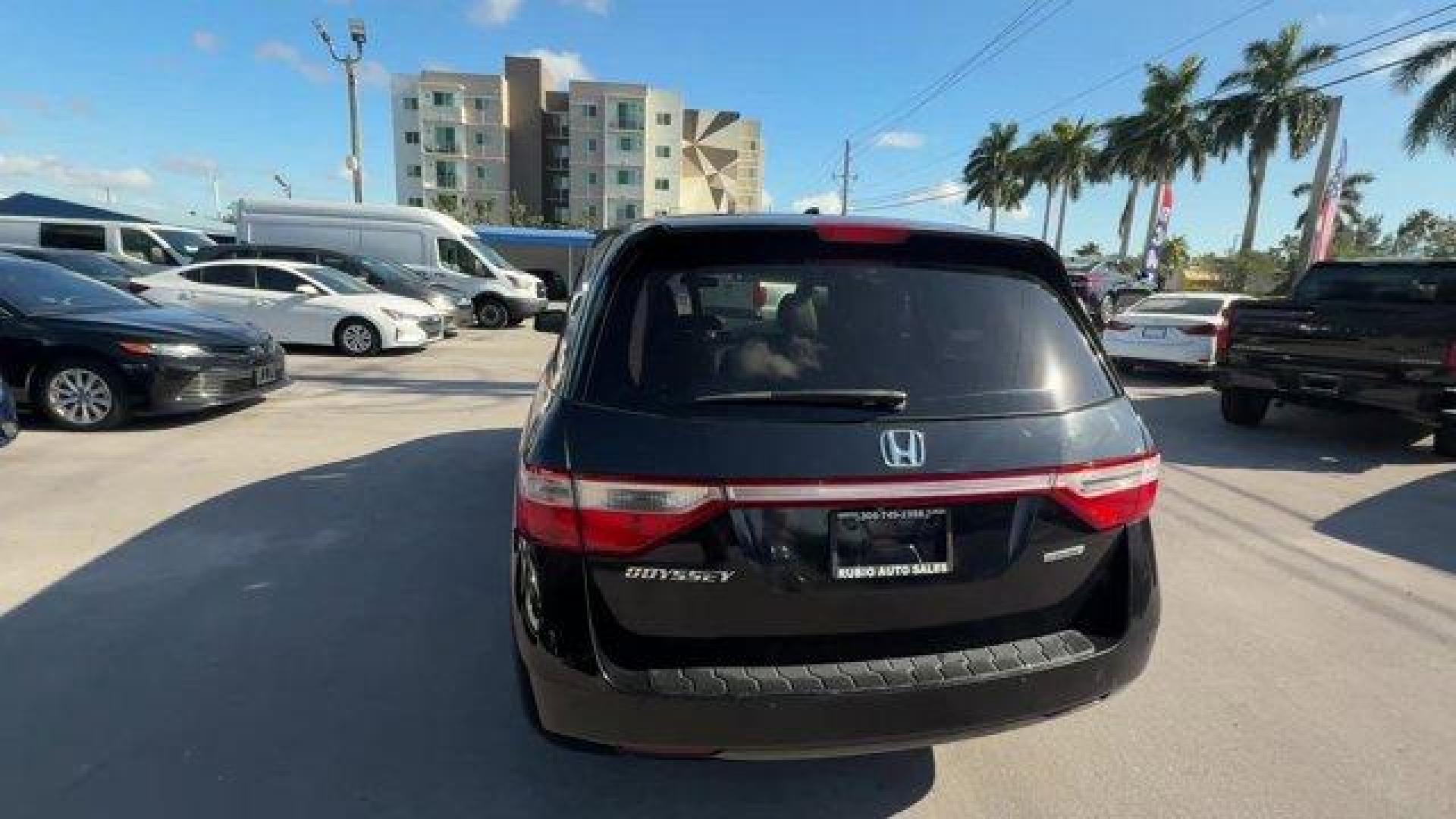 2013 Black Honda Odyssey (5FNRL5H97DB) with an 6 3.5L engine, Automatic transmission, located at 27610 S Dixie Hwy, Homestead, FL, 33032, (305) 749-2348, 25.510241, -80.438301 - KBB.com 10 Best Family Cars. Only 119,824 Miles! Boasts 28 Highway MPG and 19 City MPG! This Honda Odyssey boasts a Gas V6 3.5L/212 engine powering this Automatic transmission. XM Radio (subscription required), Wide-mode adjustable 2nd-row seats -inc: leather trimmed outboard seats, multi-function c - Photo#3