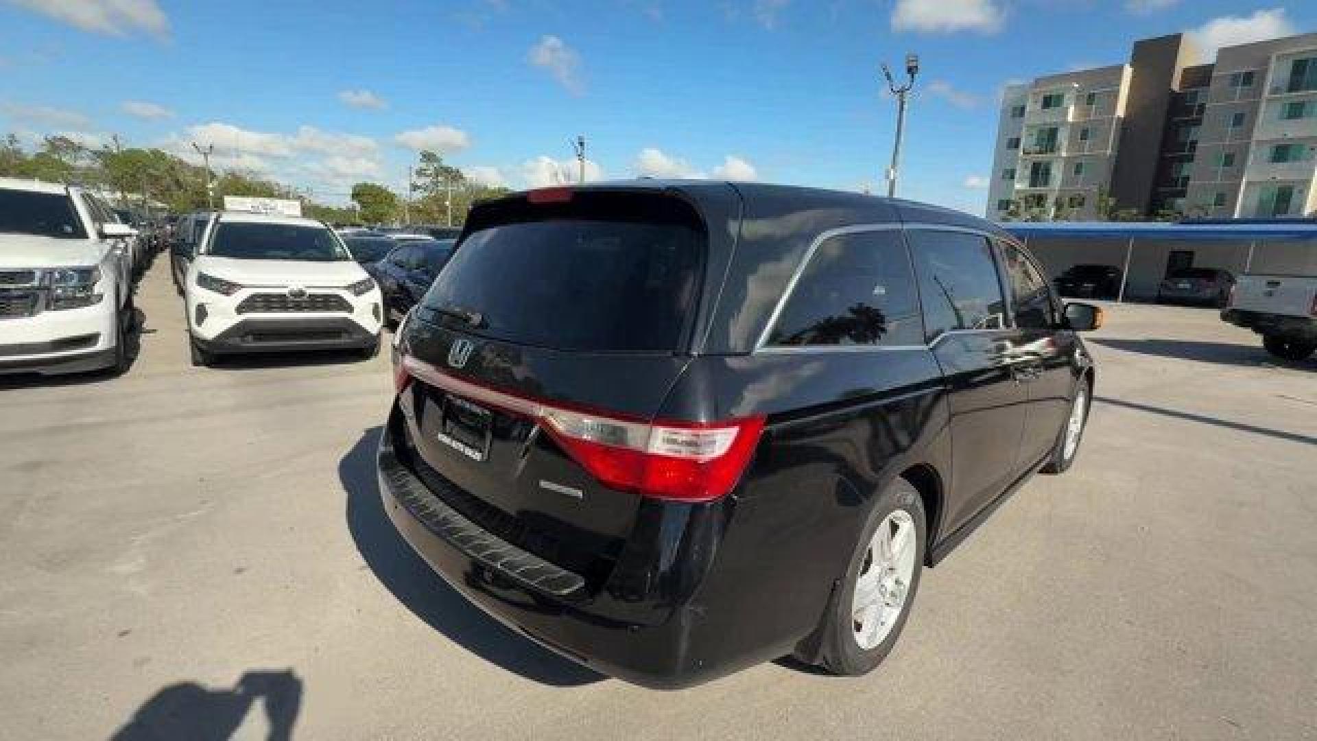 2013 Black Honda Odyssey (5FNRL5H97DB) with an 6 3.5L engine, Automatic transmission, located at 27610 S Dixie Hwy, Homestead, FL, 33032, (305) 749-2348, 25.510241, -80.438301 - KBB.com 10 Best Family Cars. Only 119,824 Miles! Boasts 28 Highway MPG and 19 City MPG! This Honda Odyssey boasts a Gas V6 3.5L/212 engine powering this Automatic transmission. XM Radio (subscription required), Wide-mode adjustable 2nd-row seats -inc: leather trimmed outboard seats, multi-function c - Photo#4