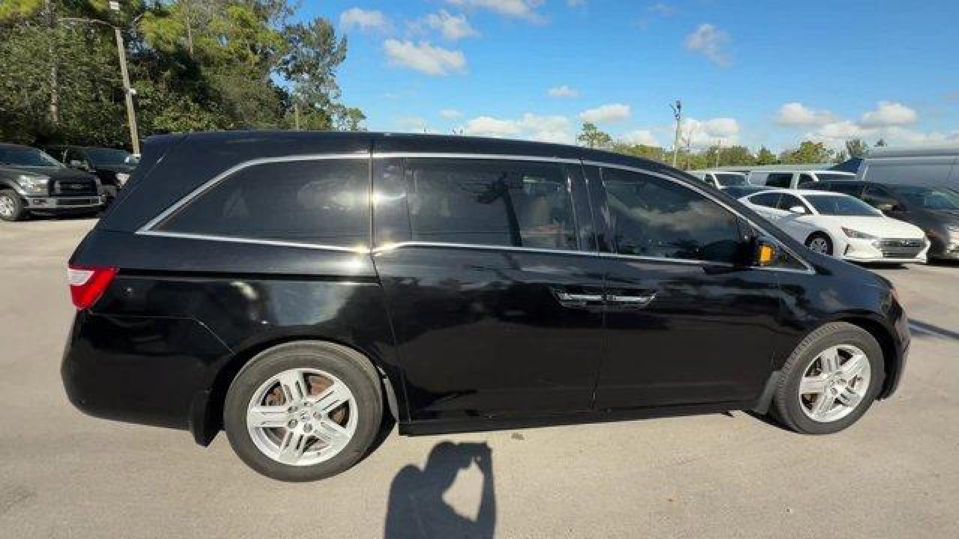 2013 Black Honda Odyssey (5FNRL5H97DB) with an 6 3.5L engine, Automatic transmission, located at 27610 S Dixie Hwy, Homestead, FL, 33032, (305) 749-2348, 25.510241, -80.438301 - KBB.com 10 Best Family Cars. Only 119,824 Miles! Boasts 28 Highway MPG and 19 City MPG! This Honda Odyssey boasts a Gas V6 3.5L/212 engine powering this Automatic transmission. XM Radio (subscription required), Wide-mode adjustable 2nd-row seats -inc: leather trimmed outboard seats, multi-function c - Photo#5