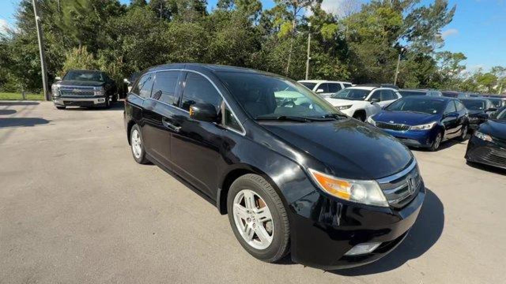 2013 Black Honda Odyssey (5FNRL5H97DB) with an 6 3.5L engine, Automatic transmission, located at 27610 S Dixie Hwy, Homestead, FL, 33032, (305) 749-2348, 25.510241, -80.438301 - KBB.com 10 Best Family Cars. Only 119,824 Miles! Boasts 28 Highway MPG and 19 City MPG! This Honda Odyssey boasts a Gas V6 3.5L/212 engine powering this Automatic transmission. XM Radio (subscription required), Wide-mode adjustable 2nd-row seats -inc: leather trimmed outboard seats, multi-function c - Photo#6