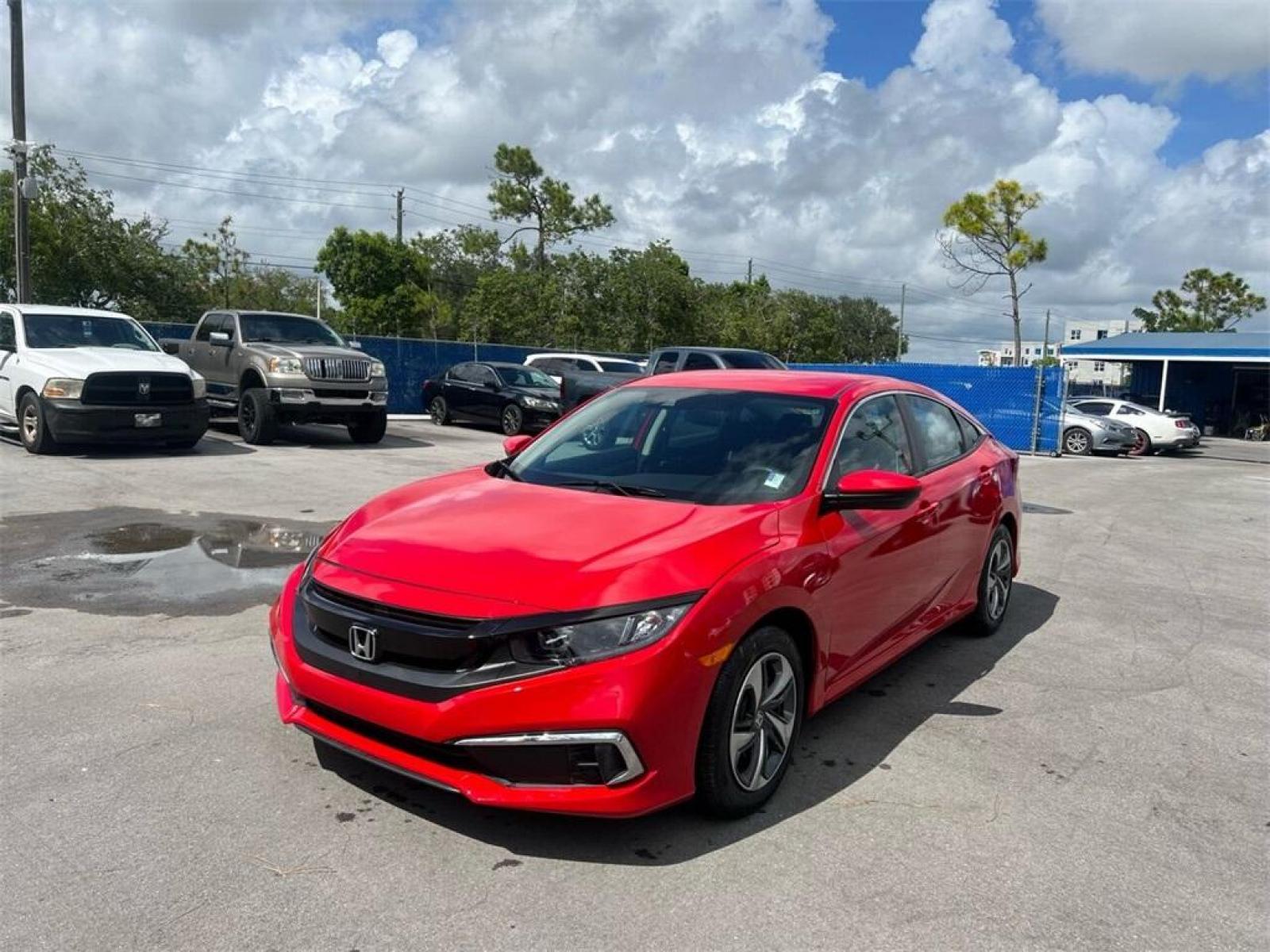 2019 Red Honda Civic LX (2HGFC2F66KH) with an 2.0L I4 DOHC 16V i-VTEC engine, CVT transmission, located at 27610 S Dixie Hwy, Homestead, FL, 33032, (305) 749-2348, 25.510241, -80.438301 - Photo #0