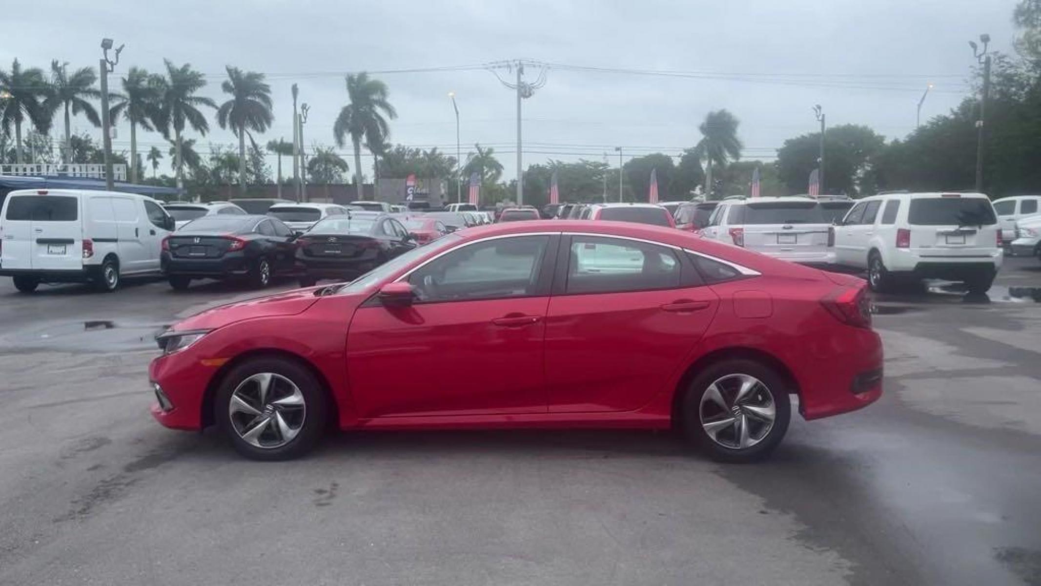 2019 Red /Black Honda Civic LX (2HGFC2F66KH) with an 2.0L I4 DOHC 16V i-VTEC engine, CVT transmission, located at 27610 S Dixie Hwy, Homestead, FL, 33032, (305) 749-2348, 25.510241, -80.438301 - Photo #2