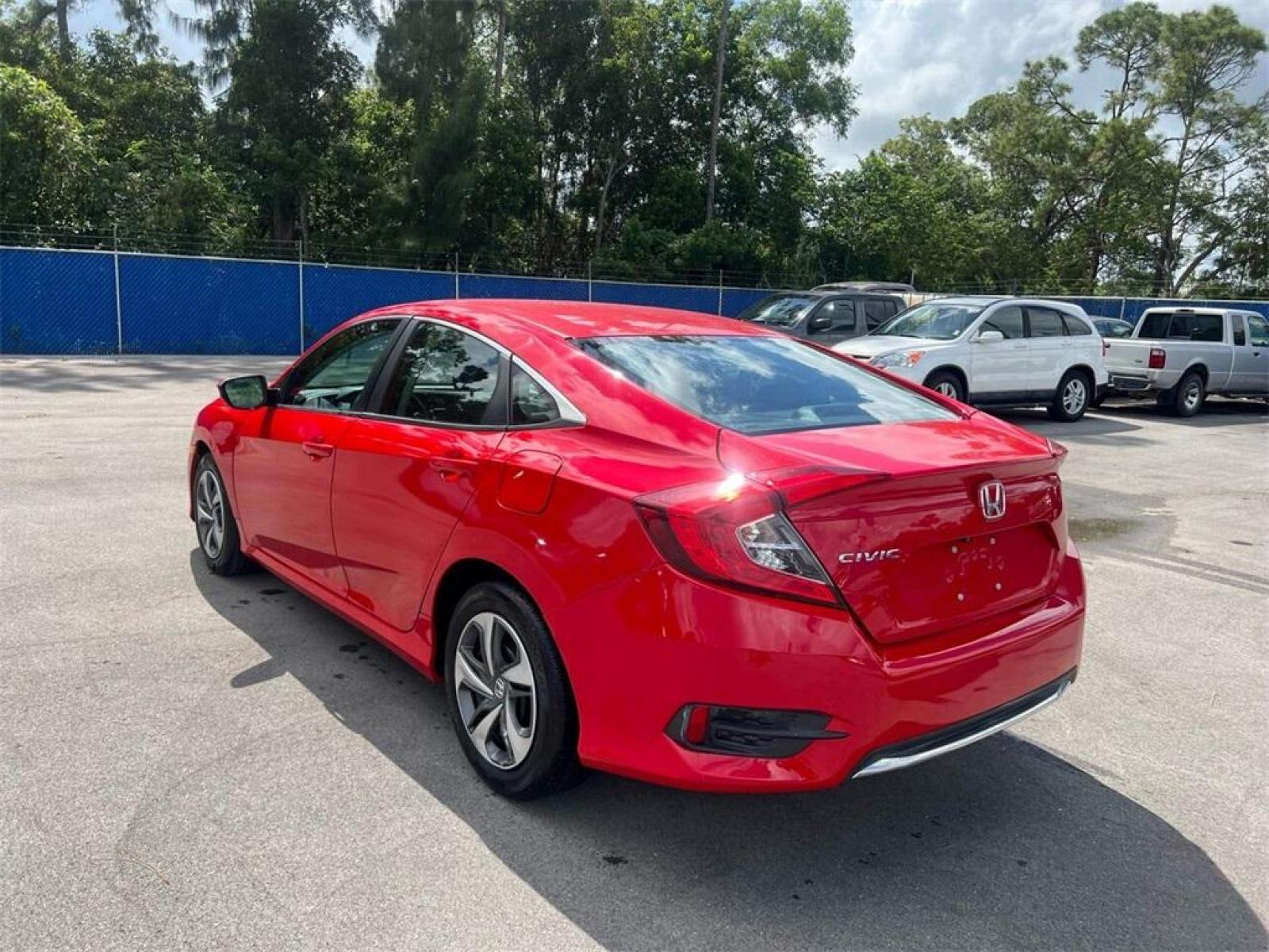 2019 Red Honda Civic LX (2HGFC2F66KH) with an 2.0L I4 DOHC 16V i-VTEC engine, CVT transmission, located at 27610 S Dixie Hwy, Homestead, FL, 33032, (305) 749-2348, 25.510241, -80.438301 - Photo #2