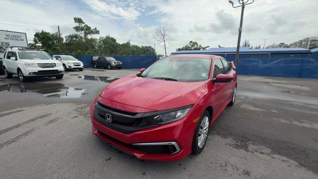 2019 Red Honda Civic Sedan LX (2HGFC2F66KH) with an 4 2.0 L engine, Variable transmission, located at 27610 S Dixie Hwy, Homestead, FL, 33032, (305) 749-2348, 25.510241, -80.438301 - Only 43,117 Miles! Delivers 38 Highway MPG and 30 City MPG! This Honda Civic Sedan delivers a Regular Unleaded I-4 2.0 L/122 engine powering this Variable transmission. Window Grid Antenna, Wheels: 16 w/Full Covers, VSA Electronic Stability Control (ESC).*This Honda Civic Sedan Comes Equipped with T - Photo#0