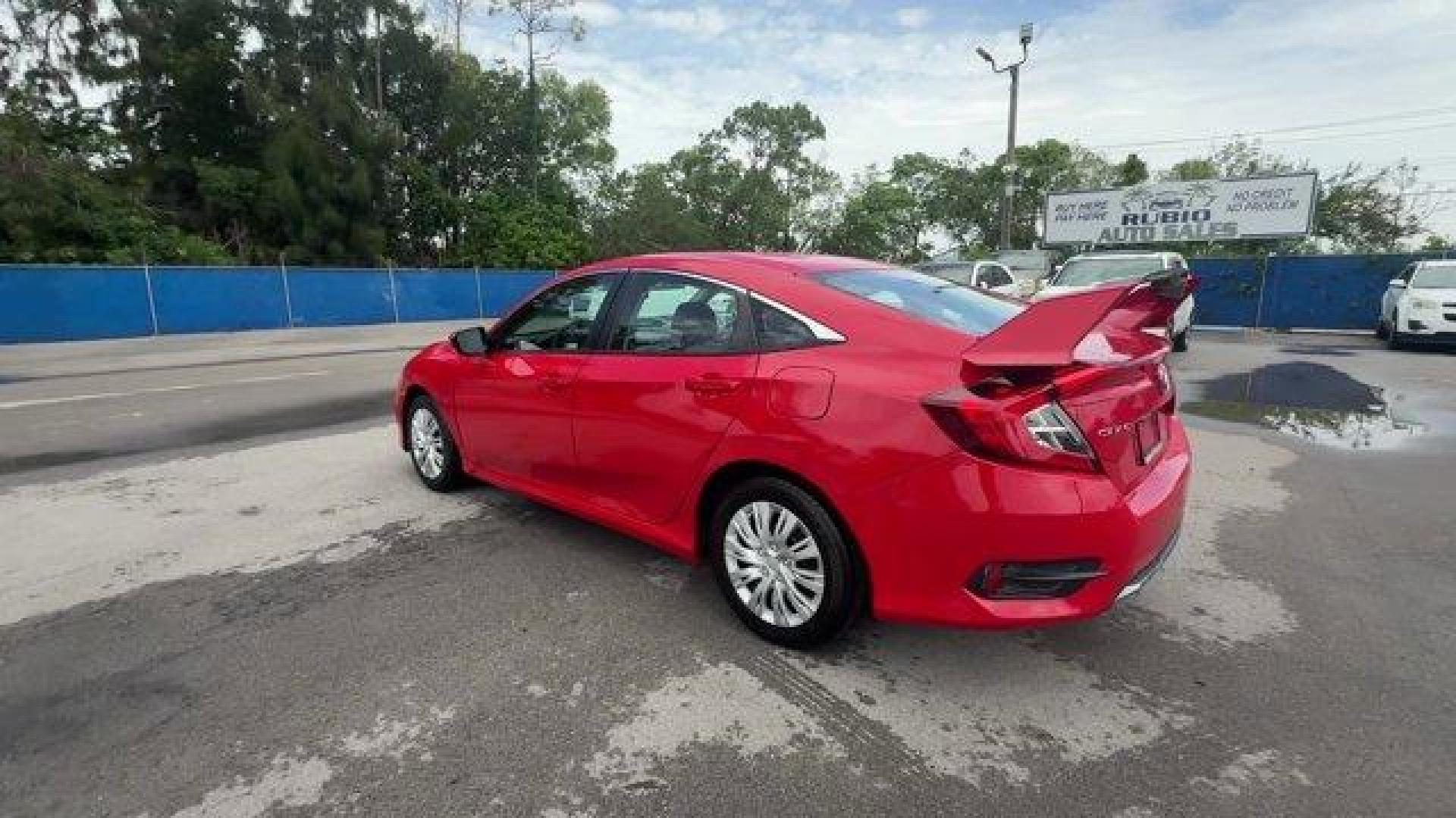 2019 Red Honda Civic Sedan LX (2HGFC2F66KH) with an 4 2.0 L engine, Variable transmission, located at 27610 S Dixie Hwy, Homestead, FL, 33032, (305) 749-2348, 25.510241, -80.438301 - Only 43,117 Miles! Delivers 38 Highway MPG and 30 City MPG! This Honda Civic Sedan delivers a Regular Unleaded I-4 2.0 L/122 engine powering this Variable transmission. Window Grid Antenna, Wheels: 16 w/Full Covers, VSA Electronic Stability Control (ESC).*This Honda Civic Sedan Comes Equipped with T - Photo#2