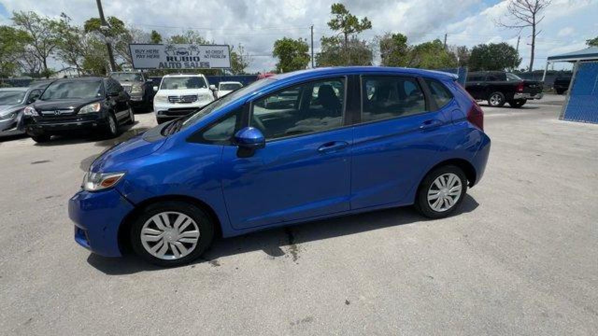 2015 Blue Honda Fit LX (3HGGK5H55FM) with an 4 1.5 L engine, Variable transmission, located at 27610 S Dixie Hwy, Homestead, FL, 33032, (305) 749-2348, 25.510241, -80.438301 - IIHS Top Safety Pick. Only 82,259 Miles! Delivers 41 Highway MPG and 33 City MPG! This Honda Fit delivers a Regular Unleaded I-4 1.5 L/91 engine powering this Variable transmission. VSA Electronic Stability Control (ESC), Urethane Gear Shifter Material, Trip Computer.*This Honda Fit Comes Equipped w - Photo#1