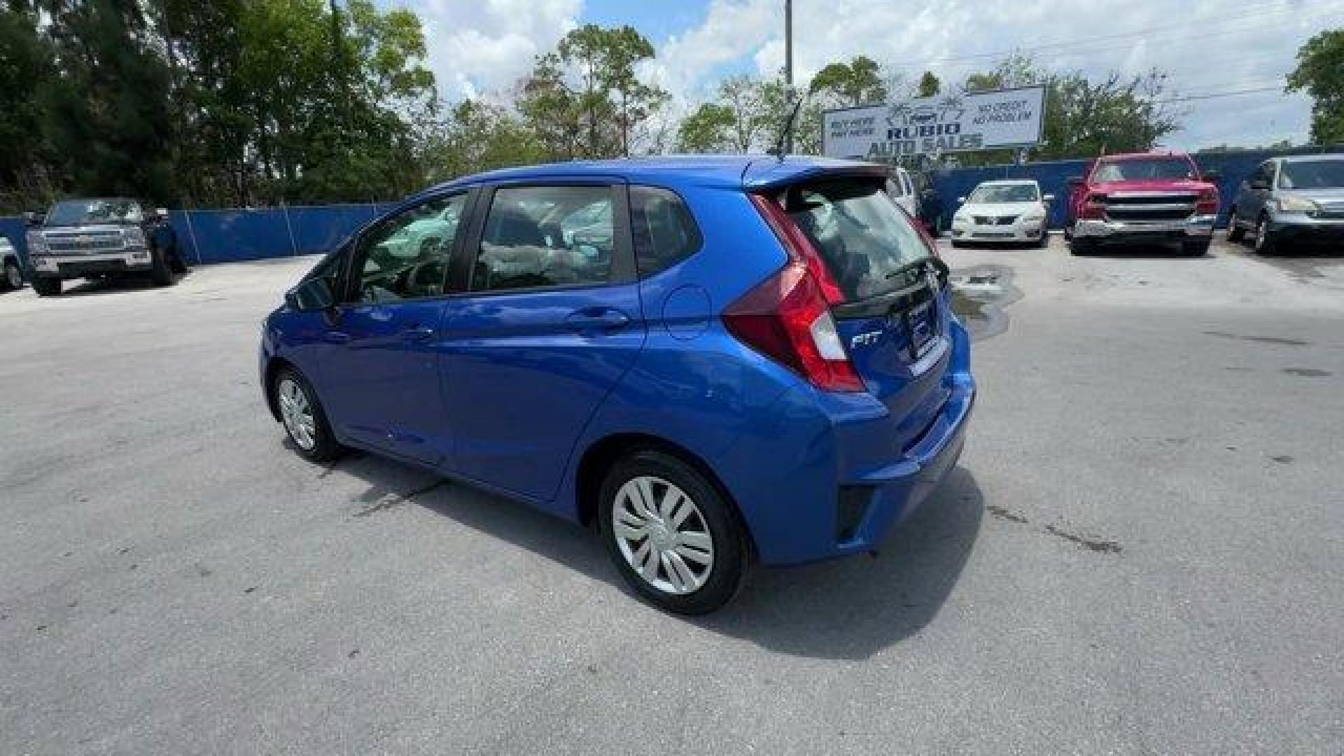 2015 Blue Honda Fit LX (3HGGK5H55FM) with an 4 1.5 L engine, Variable transmission, located at 27610 S Dixie Hwy, Homestead, FL, 33032, (305) 749-2348, 25.510241, -80.438301 - IIHS Top Safety Pick. Only 82,259 Miles! Delivers 41 Highway MPG and 33 City MPG! This Honda Fit delivers a Regular Unleaded I-4 1.5 L/91 engine powering this Variable transmission. VSA Electronic Stability Control (ESC), Urethane Gear Shifter Material, Trip Computer.*This Honda Fit Comes Equipped w - Photo#2