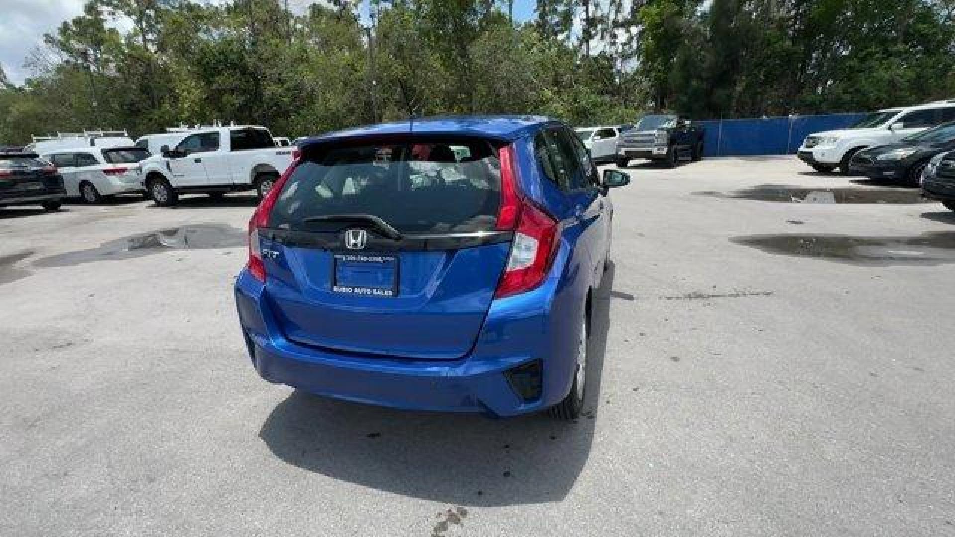 2015 Blue Honda Fit LX (3HGGK5H55FM) with an 4 1.5 L engine, Variable transmission, located at 27610 S Dixie Hwy, Homestead, FL, 33032, (305) 749-2348, 25.510241, -80.438301 - IIHS Top Safety Pick. Only 82,259 Miles! Delivers 41 Highway MPG and 33 City MPG! This Honda Fit delivers a Regular Unleaded I-4 1.5 L/91 engine powering this Variable transmission. VSA Electronic Stability Control (ESC), Urethane Gear Shifter Material, Trip Computer.*This Honda Fit Comes Equipped w - Photo#4