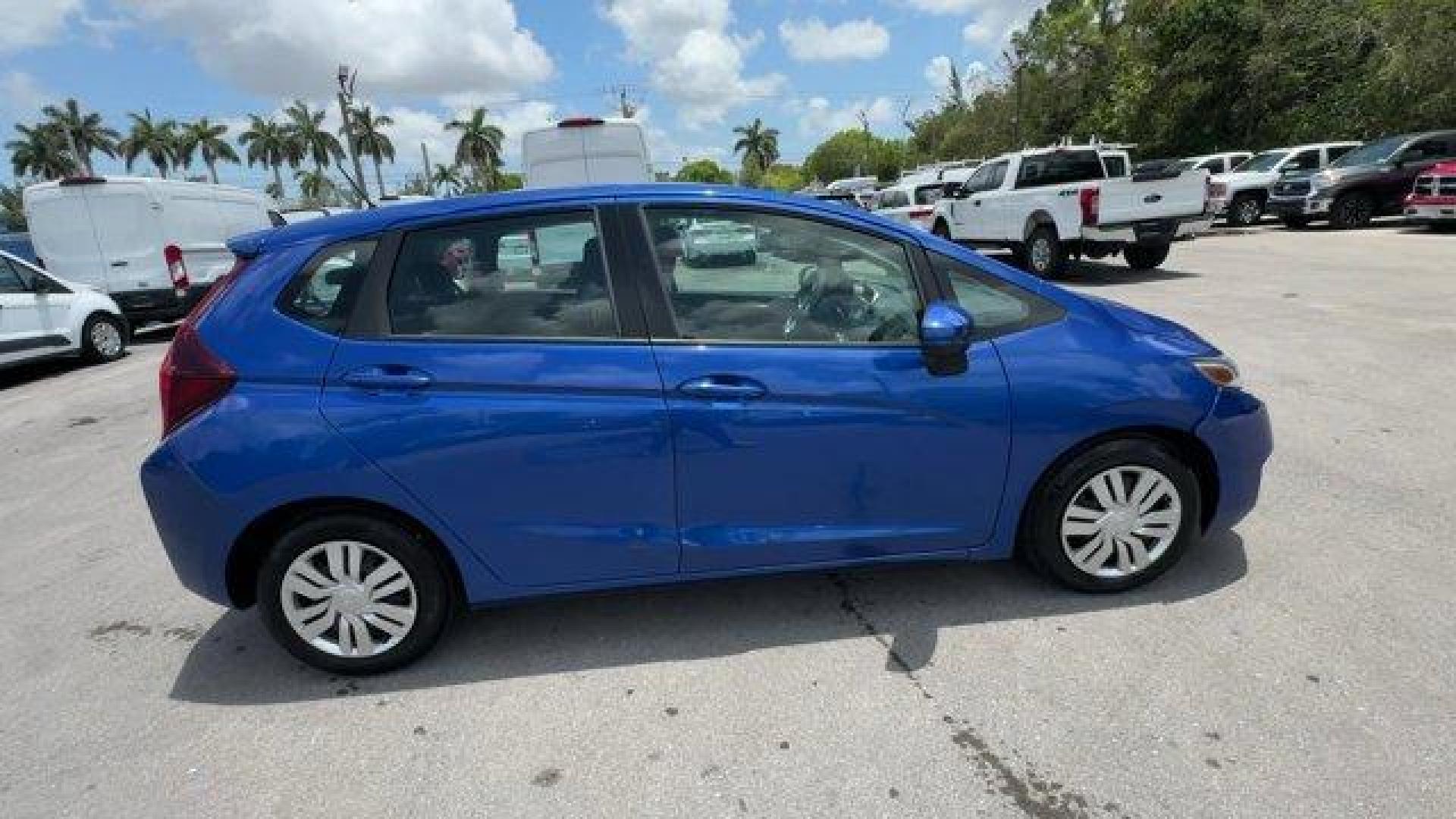 2015 Blue Honda Fit LX (3HGGK5H55FM) with an 4 1.5 L engine, Variable transmission, located at 27610 S Dixie Hwy, Homestead, FL, 33032, (305) 749-2348, 25.510241, -80.438301 - IIHS Top Safety Pick. Only 82,259 Miles! Delivers 41 Highway MPG and 33 City MPG! This Honda Fit delivers a Regular Unleaded I-4 1.5 L/91 engine powering this Variable transmission. VSA Electronic Stability Control (ESC), Urethane Gear Shifter Material, Trip Computer.*This Honda Fit Comes Equipped w - Photo#5