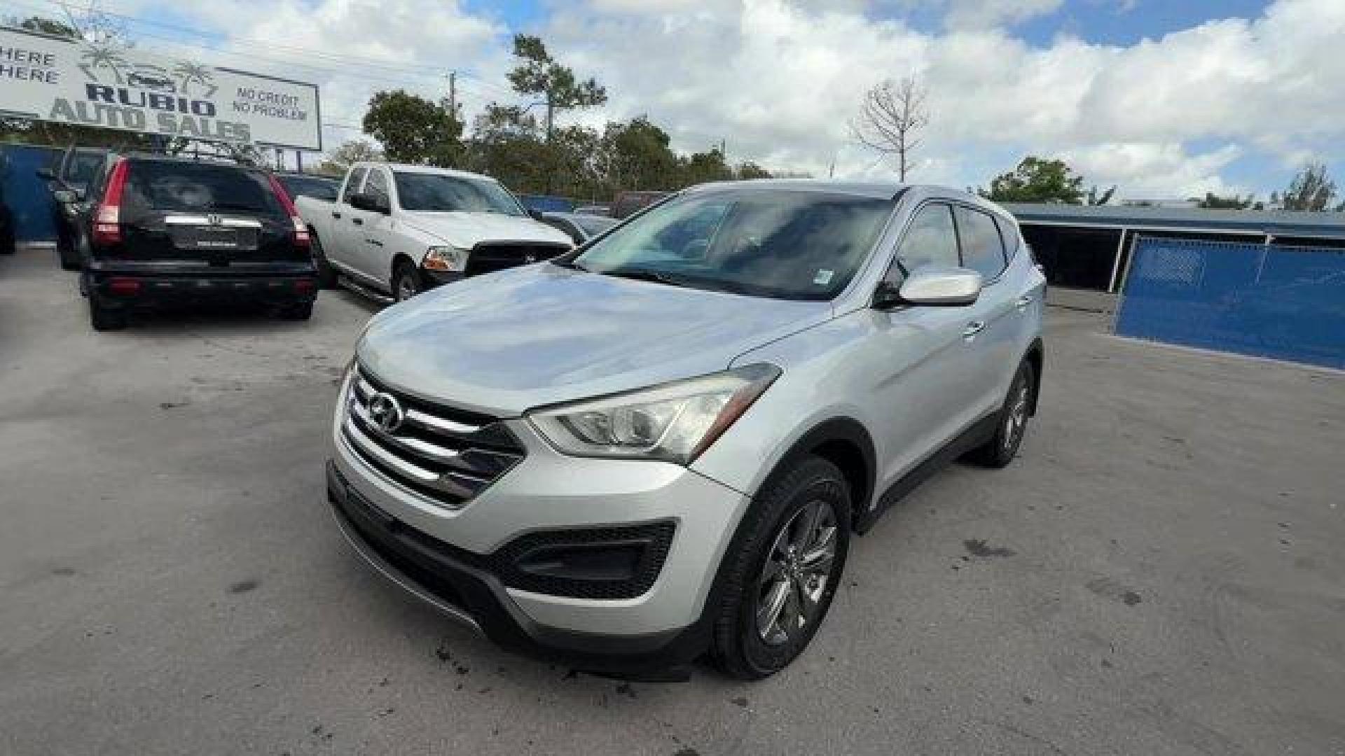 2014 Moonstone Silver /Gray Hyundai Santa Fe Sport Sport 2.4 FWD (5XYZT3LB0EG) with an 4 2.4 L engine, Automatic transmission, located at 27610 S Dixie Hwy, Homestead, FL, 33032, (305) 749-2348, 25.510241, -80.438301 - Boasts 27 Highway MPG and 20 City MPG! This Hyundai Santa Fe Sport delivers a Regular Unleaded I-4 2.4 L/144 engine powering this Automatic transmission. WHEEL LOCKS, REMOTE ENGINE START, OPTION GROUP 01 -inc: standard equipment.*This Hyundai Santa Fe Sport Comes Equipped with These Options *MUDGUAR - Photo#0