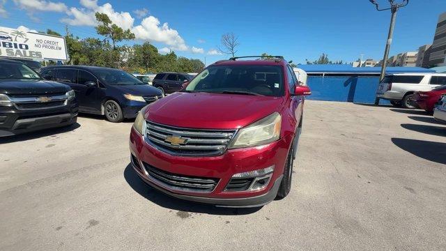 2013 Crystal Red Tintcoat /Ebony/Mojave Chevrolet Traverse 1LT FWD (1GNKRGKD0DJ) with an 6 3.6L engine, Automatic transmission, located at 27610 S Dixie Hwy, Homestead, FL, 33032, (305) 749-2348, 25.510241, -80.438301 - IIHS Top Safety Pick. Only 131,893 Miles! Boasts 24 Highway MPG and 17 City MPG! This Chevrolet Traverse delivers a Gas V6 3.6L/217 engine powering this Automatic transmission. SEATING, 8-PASSENGER (2-3-3 SEATING CONFIGURATION) with 2nd and 3rd row 60/40 split flat-folding bench seat (STD), RECLININ - Photo#0