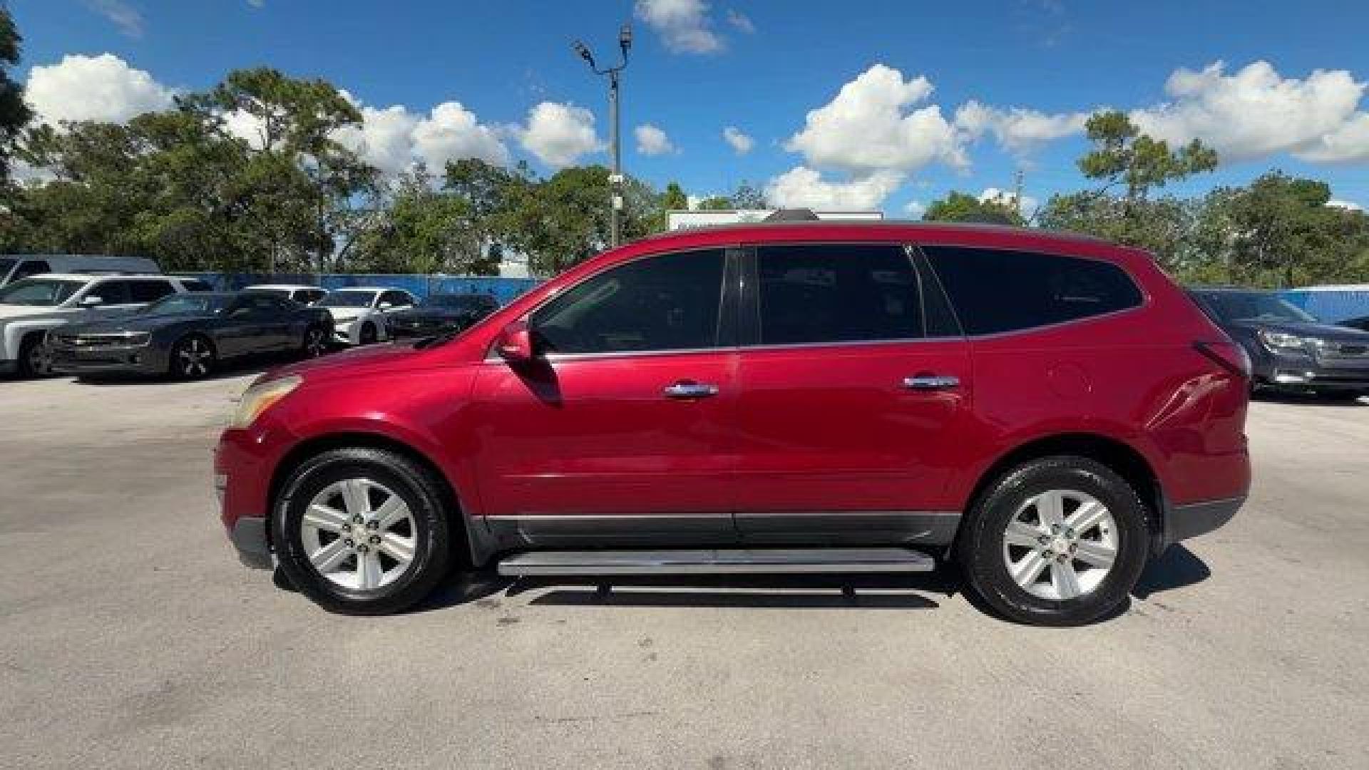 2013 Crystal Red Tintcoat /Ebony/Mojave Chevrolet Traverse 1LT FWD (1GNKRGKD0DJ) with an 6 3.6L engine, Automatic transmission, located at 27610 S Dixie Hwy, Homestead, FL, 33032, (305) 749-2348, 25.510241, -80.438301 - IIHS Top Safety Pick. Only 131,893 Miles! Boasts 24 Highway MPG and 17 City MPG! This Chevrolet Traverse delivers a Gas V6 3.6L/217 engine powering this Automatic transmission. SEATING, 8-PASSENGER (2-3-3 SEATING CONFIGURATION) with 2nd and 3rd row 60/40 split flat-folding bench seat (STD), RECLININ - Photo#1