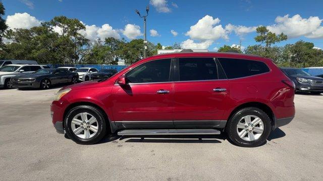 2013 Crystal Red Tintcoat /Ebony/Mojave Chevrolet Traverse 1LT FWD (1GNKRGKD0DJ) with an 6 3.6L engine, Automatic transmission, located at 27610 S Dixie Hwy, Homestead, FL, 33032, (305) 749-2348, 25.510241, -80.438301 - IIHS Top Safety Pick. Only 131,893 Miles! Boasts 24 Highway MPG and 17 City MPG! This Chevrolet Traverse delivers a Gas V6 3.6L/217 engine powering this Automatic transmission. SEATING, 8-PASSENGER (2-3-3 SEATING CONFIGURATION) with 2nd and 3rd row 60/40 split flat-folding bench seat (STD), RECLININ - Photo#1