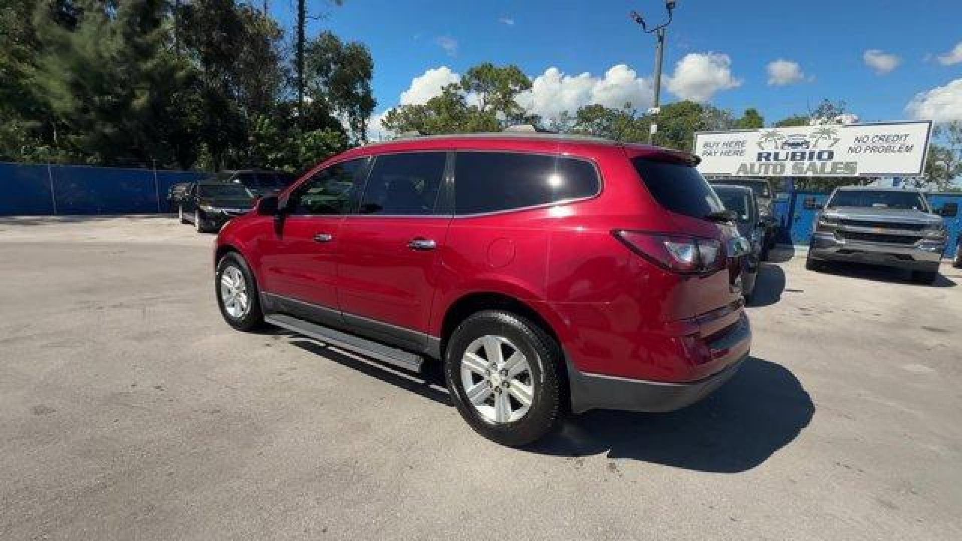 2013 Crystal Red Tintcoat /Ebony/Mojave Chevrolet Traverse 1LT FWD (1GNKRGKD0DJ) with an 6 3.6L engine, Automatic transmission, located at 27610 S Dixie Hwy, Homestead, FL, 33032, (305) 749-2348, 25.510241, -80.438301 - IIHS Top Safety Pick. Only 131,893 Miles! Boasts 24 Highway MPG and 17 City MPG! This Chevrolet Traverse delivers a Gas V6 3.6L/217 engine powering this Automatic transmission. SEATING, 8-PASSENGER (2-3-3 SEATING CONFIGURATION) with 2nd and 3rd row 60/40 split flat-folding bench seat (STD), RECLININ - Photo#2