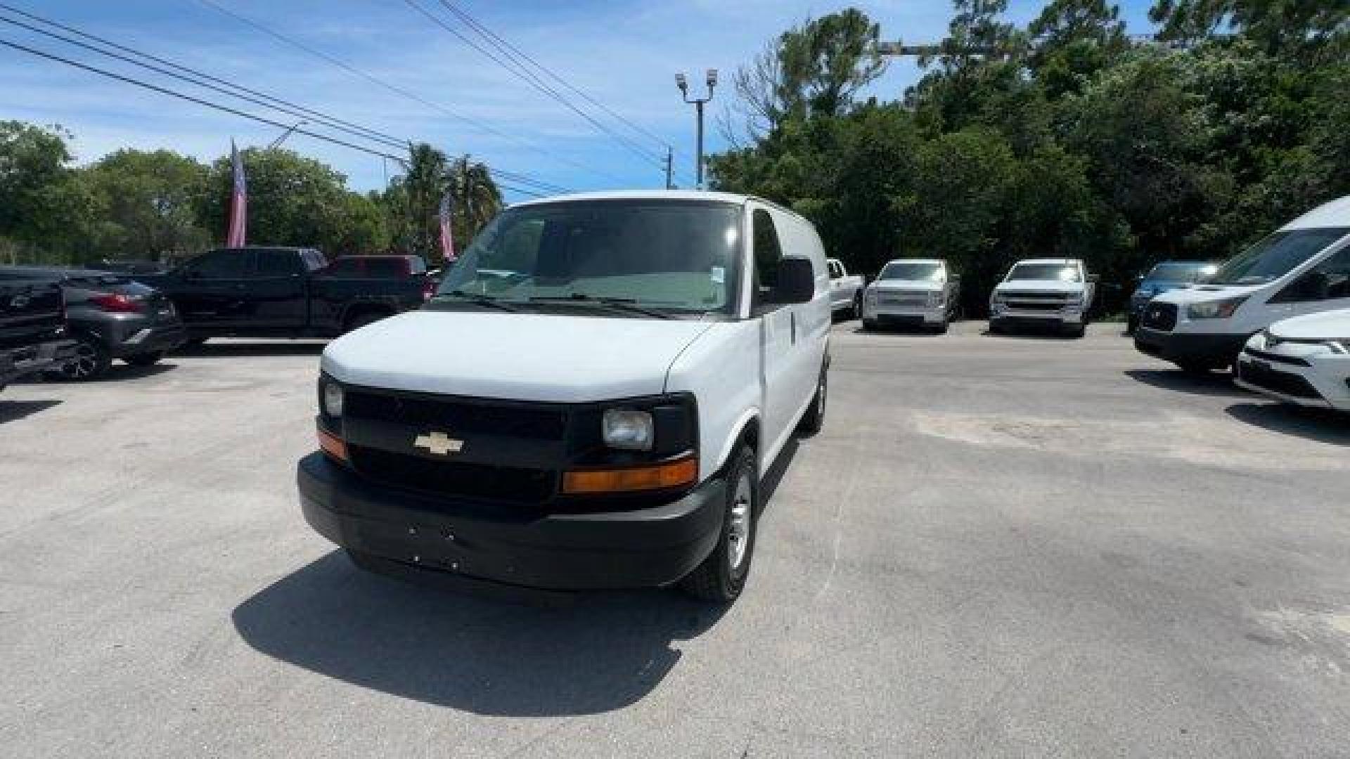 2014 Summit White /Medium Pewter Chevrolet Express Cargo Van Work Van (1GCWGFCA3E1) with an 8 4.8L engine, Automatic transmission, located at 27610 S Dixie Hwy, Homestead, FL, 33032, (305) 749-2348, 25.510241, -80.438301 - KBB.com Brand Image Awards. This Chevrolet Express Cargo Van delivers a Gas/Ethanol V8 4.8L/293 engine powering this Automatic transmission. TRANSMISSION, 6-SPEED AUTOMATIC, HEAVY-DUTY, ELECTRONICALLY CONTROLLED with overdrive tow/haul mode and internal transmission oil cooler (STD), TRAILER WIRING, - Photo#0