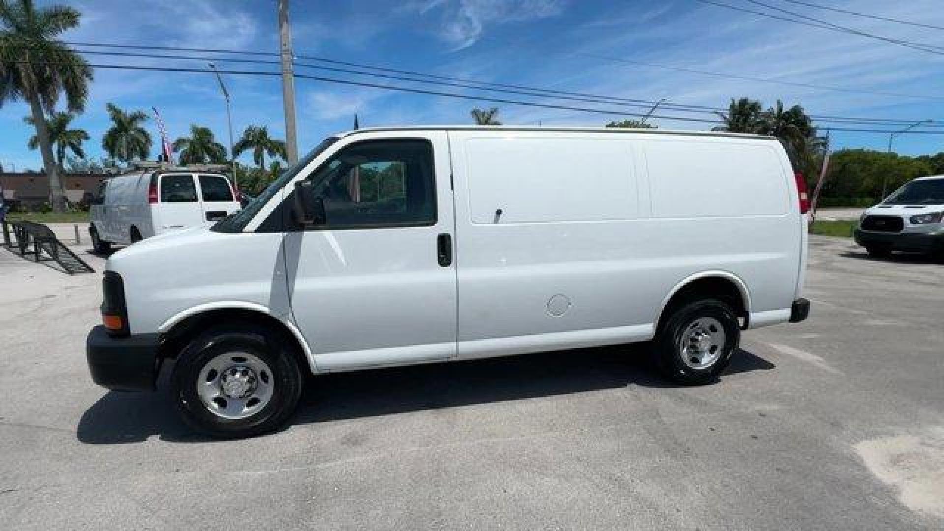 2014 Summit White /Medium Pewter Chevrolet Express Cargo Van Work Van (1GCWGFCA3E1) with an 8 4.8L engine, Automatic transmission, located at 27610 S Dixie Hwy, Homestead, FL, 33032, (305) 749-2348, 25.510241, -80.438301 - KBB.com Brand Image Awards. This Chevrolet Express Cargo Van delivers a Gas/Ethanol V8 4.8L/293 engine powering this Automatic transmission. TRANSMISSION, 6-SPEED AUTOMATIC, HEAVY-DUTY, ELECTRONICALLY CONTROLLED with overdrive tow/haul mode and internal transmission oil cooler (STD), TRAILER WIRING, - Photo#1