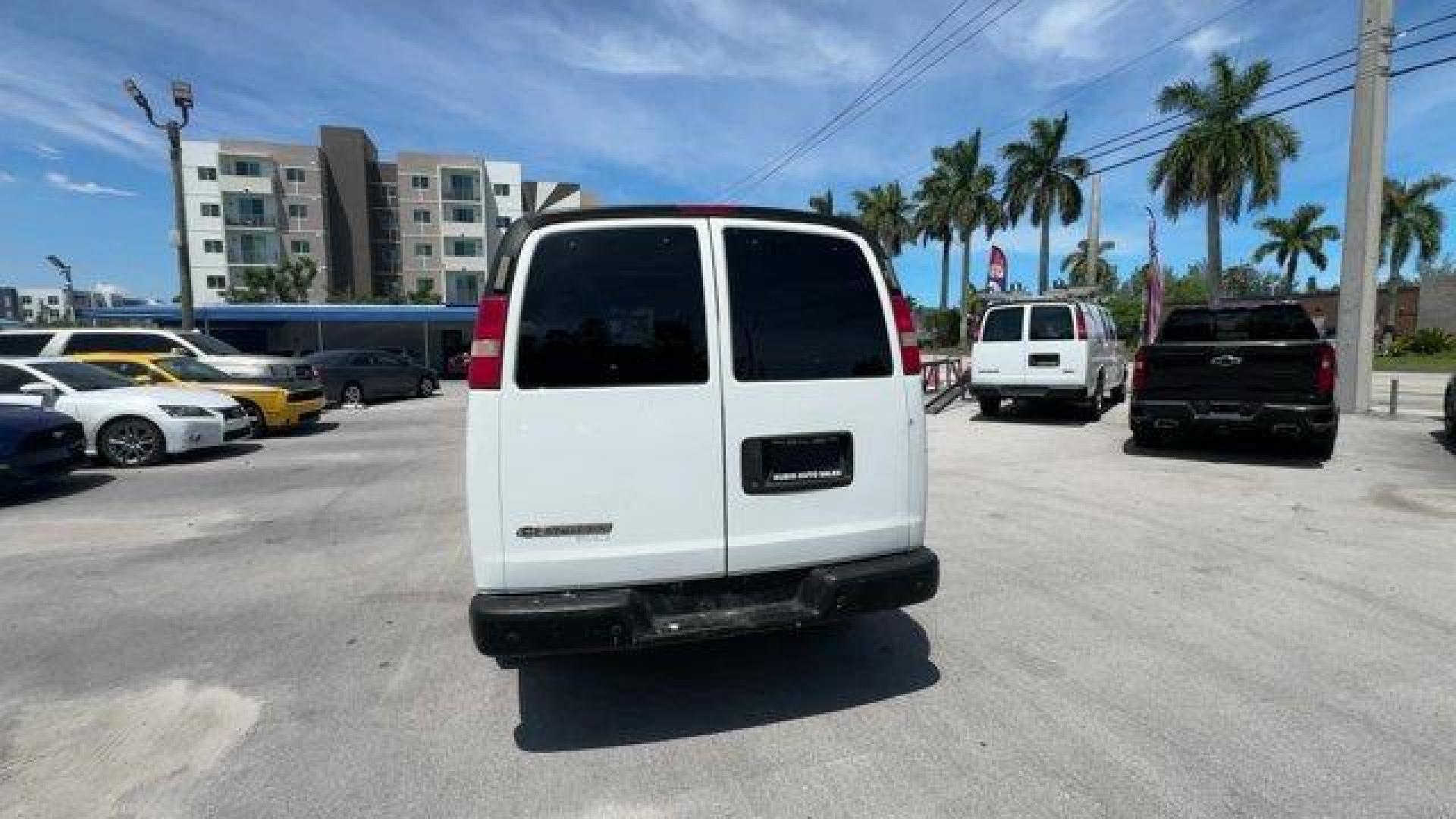 2014 Summit White /Medium Pewter Chevrolet Express Cargo Van Work Van (1GCWGFCA3E1) with an 8 4.8L engine, Automatic transmission, located at 27610 S Dixie Hwy, Homestead, FL, 33032, (305) 749-2348, 25.510241, -80.438301 - KBB.com Brand Image Awards. This Chevrolet Express Cargo Van delivers a Gas/Ethanol V8 4.8L/293 engine powering this Automatic transmission. TRANSMISSION, 6-SPEED AUTOMATIC, HEAVY-DUTY, ELECTRONICALLY CONTROLLED with overdrive tow/haul mode and internal transmission oil cooler (STD), TRAILER WIRING, - Photo#3