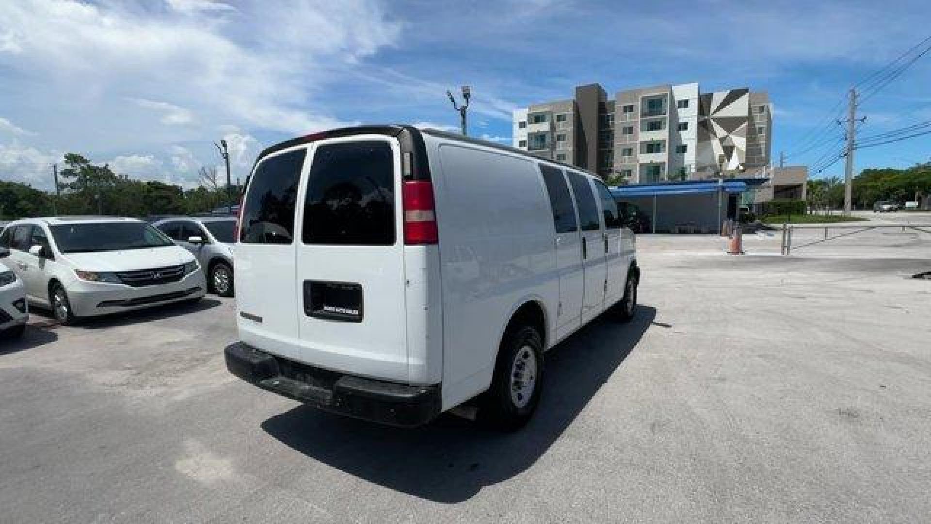 2014 Summit White /Medium Pewter Chevrolet Express Cargo Van Work Van (1GCWGFCA3E1) with an 8 4.8L engine, Automatic transmission, located at 27610 S Dixie Hwy, Homestead, FL, 33032, (305) 749-2348, 25.510241, -80.438301 - KBB.com Brand Image Awards. This Chevrolet Express Cargo Van delivers a Gas/Ethanol V8 4.8L/293 engine powering this Automatic transmission. TRANSMISSION, 6-SPEED AUTOMATIC, HEAVY-DUTY, ELECTRONICALLY CONTROLLED with overdrive tow/haul mode and internal transmission oil cooler (STD), TRAILER WIRING, - Photo#4