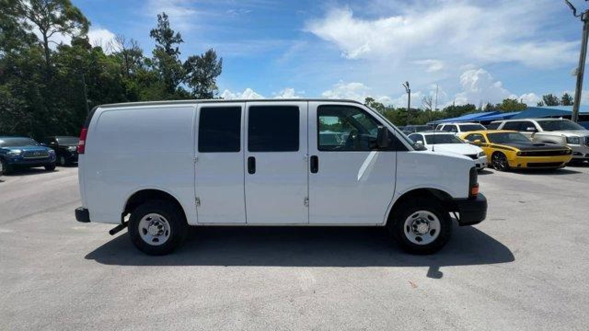 2014 Summit White /Medium Pewter Chevrolet Express Cargo Van Work Van (1GCWGFCA3E1) with an 8 4.8L engine, Automatic transmission, located at 27610 S Dixie Hwy, Homestead, FL, 33032, (305) 749-2348, 25.510241, -80.438301 - KBB.com Brand Image Awards. This Chevrolet Express Cargo Van delivers a Gas/Ethanol V8 4.8L/293 engine powering this Automatic transmission. TRANSMISSION, 6-SPEED AUTOMATIC, HEAVY-DUTY, ELECTRONICALLY CONTROLLED with overdrive tow/haul mode and internal transmission oil cooler (STD), TRAILER WIRING, - Photo#5
