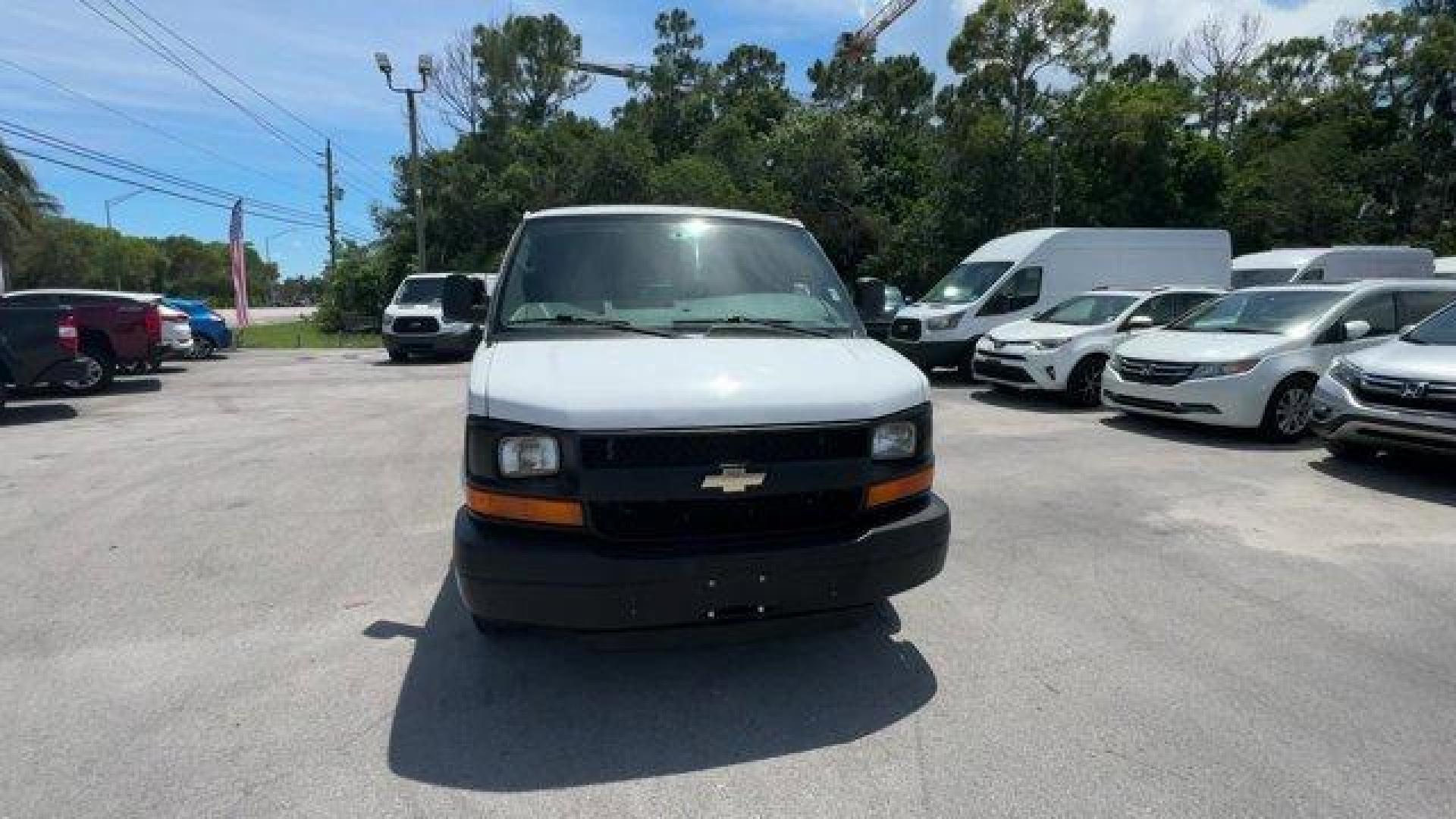 2014 Summit White /Medium Pewter Chevrolet Express Cargo Van Work Van (1GCWGFCA3E1) with an 8 4.8L engine, Automatic transmission, located at 27610 S Dixie Hwy, Homestead, FL, 33032, (305) 749-2348, 25.510241, -80.438301 - KBB.com Brand Image Awards. This Chevrolet Express Cargo Van delivers a Gas/Ethanol V8 4.8L/293 engine powering this Automatic transmission. TRANSMISSION, 6-SPEED AUTOMATIC, HEAVY-DUTY, ELECTRONICALLY CONTROLLED with overdrive tow/haul mode and internal transmission oil cooler (STD), TRAILER WIRING, - Photo#7