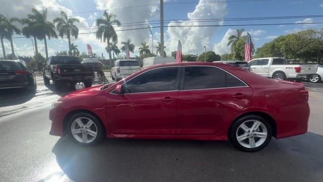 2013 Red Toyota Camry (4T1BF1FK4DU) with an 4 2.5L engine, Automatic transmission, located at 27610 S Dixie Hwy, Homestead, FL, 33032, (305) 749-2348, 25.510241, -80.438301 - KBB.com 10 Best New Sedans Under $25,000. Only 119,306 Miles! Boasts 35 Highway MPG and 25 City MPG! This Toyota Camry delivers a Gas I4 2.5L/152 engine powering this Automatic transmission. Whiplash-lessening front seats, Vehicle stability control, Variable assist pwr rack and pinion steering.* T- Photo#1