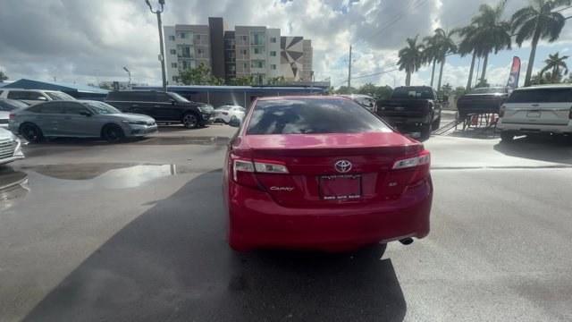 2013 Red Toyota Camry (4T1BF1FK4DU) with an 4 2.5L engine, Automatic transmission, located at 27610 S Dixie Hwy, Homestead, FL, 33032, (305) 749-2348, 25.510241, -80.438301 - KBB.com 10 Best New Sedans Under $25,000. Only 119,306 Miles! Boasts 35 Highway MPG and 25 City MPG! This Toyota Camry delivers a Gas I4 2.5L/152 engine powering this Automatic transmission. Whiplash-lessening front seats, Vehicle stability control, Variable assist pwr rack and pinion steering.* T- Photo#3
