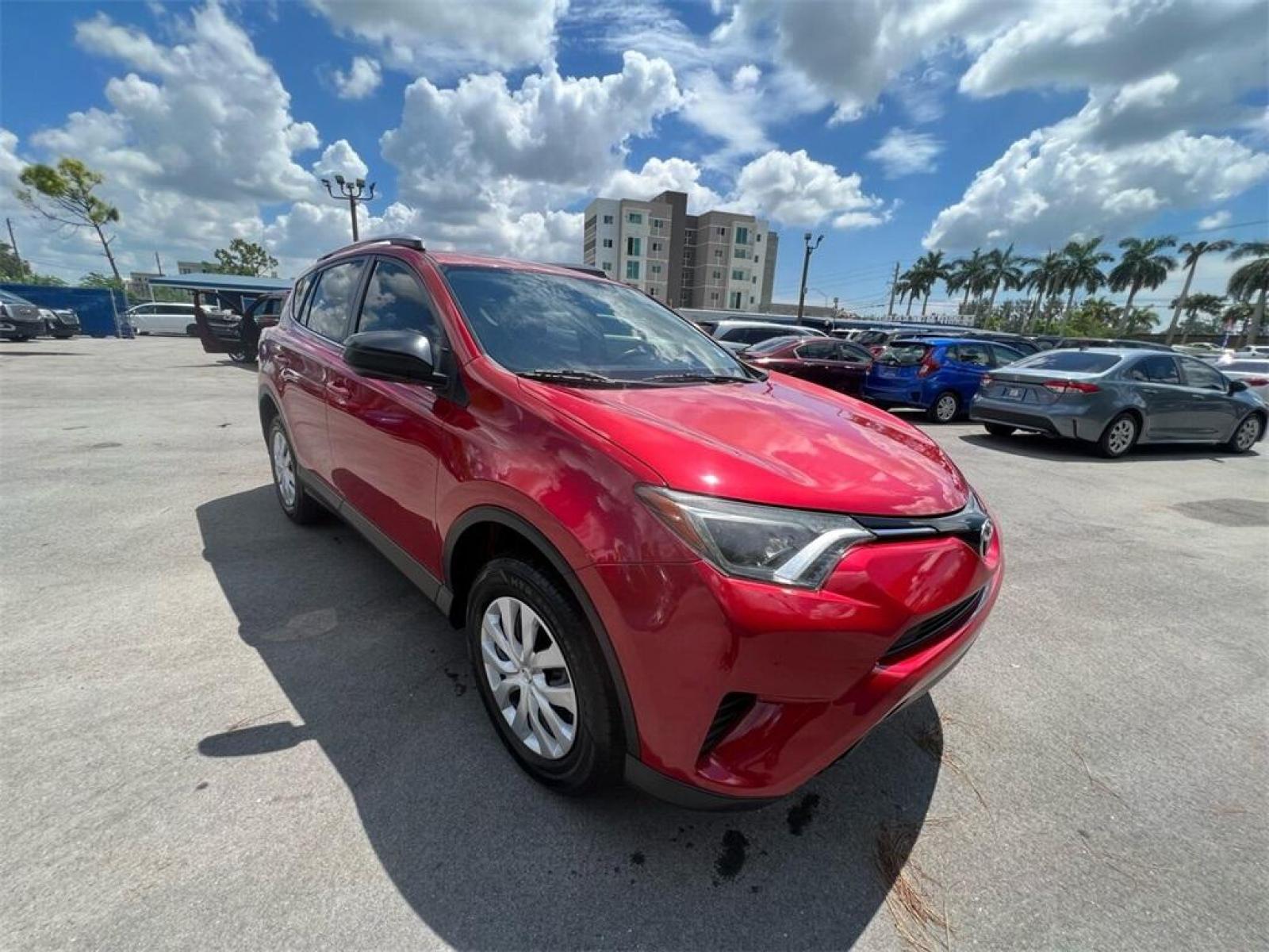 2016 Barcelona Red Metallic Toyota RAV4 LE (JTMZFREV1GJ) with an 2.5L 4-Cylinder DOHC Dual VVT-i engine, Automatic transmission, located at 27610 S Dixie Hwy, Homestead, FL, 33032, (305) 749-2348, 25.510241, -80.438301 - Photo #2