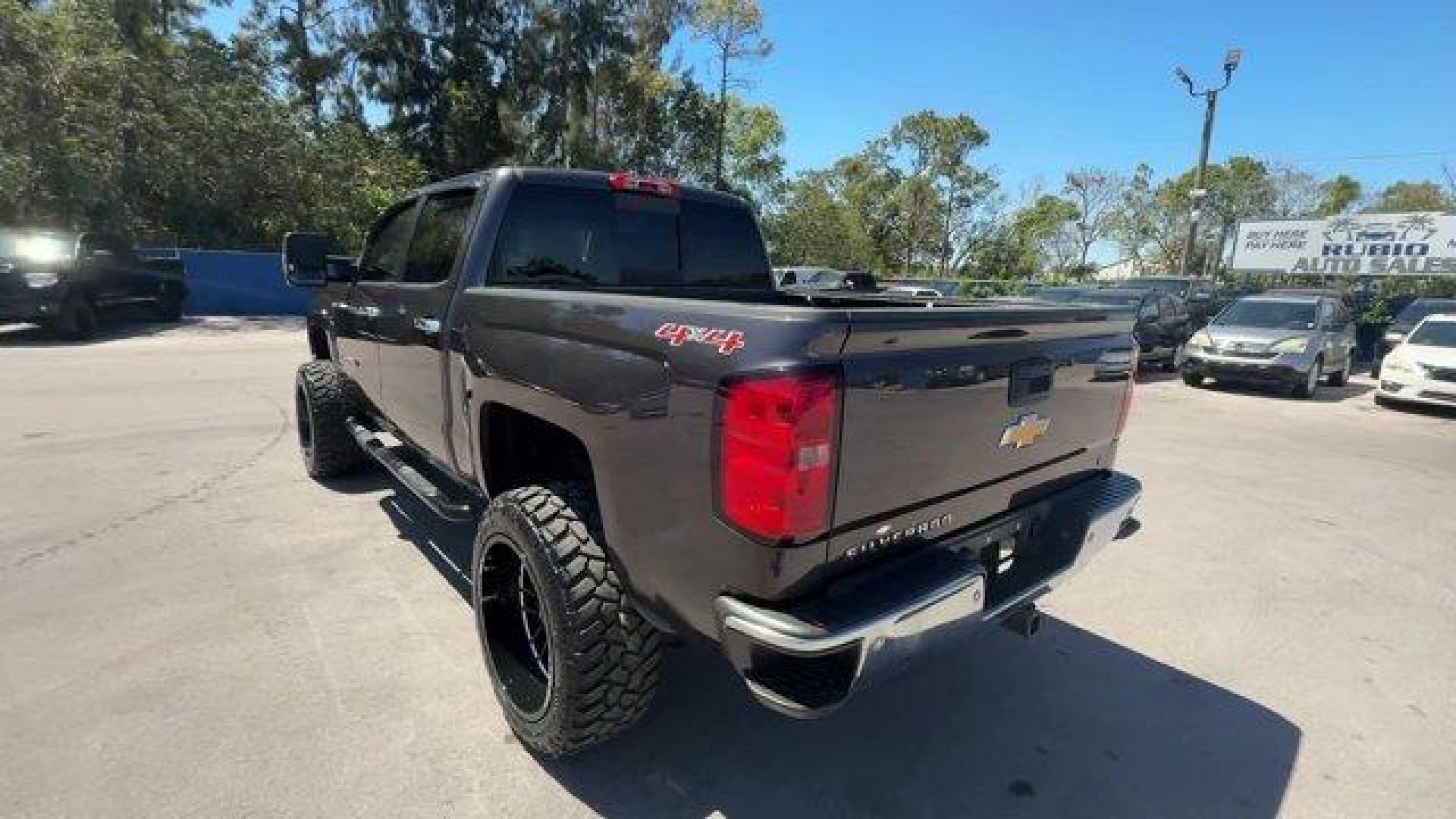 2014 Tungsten Metallic /Jet Black Chevrolet Silverado 1500 LT (3GCUKREC9EG) with an 8 5.3L engine, Automatic transmission, located at 27610 S Dixie Hwy, Homestead, FL, 33032, (305) 749-2348, 25.510241, -80.438301 - NACTOY 2014 North American Truck of the Year. Boasts 22 Highway MPG and 16 City MPG! This Chevrolet Silverado 1500 boasts a Gas/Ethanol V8 5.3L/325 engine powering this Automatic transmission. WINDOW, POWER, REAR SLIDING WITH REAR DEFOGGER, WHEELS, 18 X 8.5 (45.7 CM X 21.6 CM) BRIGHT-MACHINED ALUMIN - Photo#2
