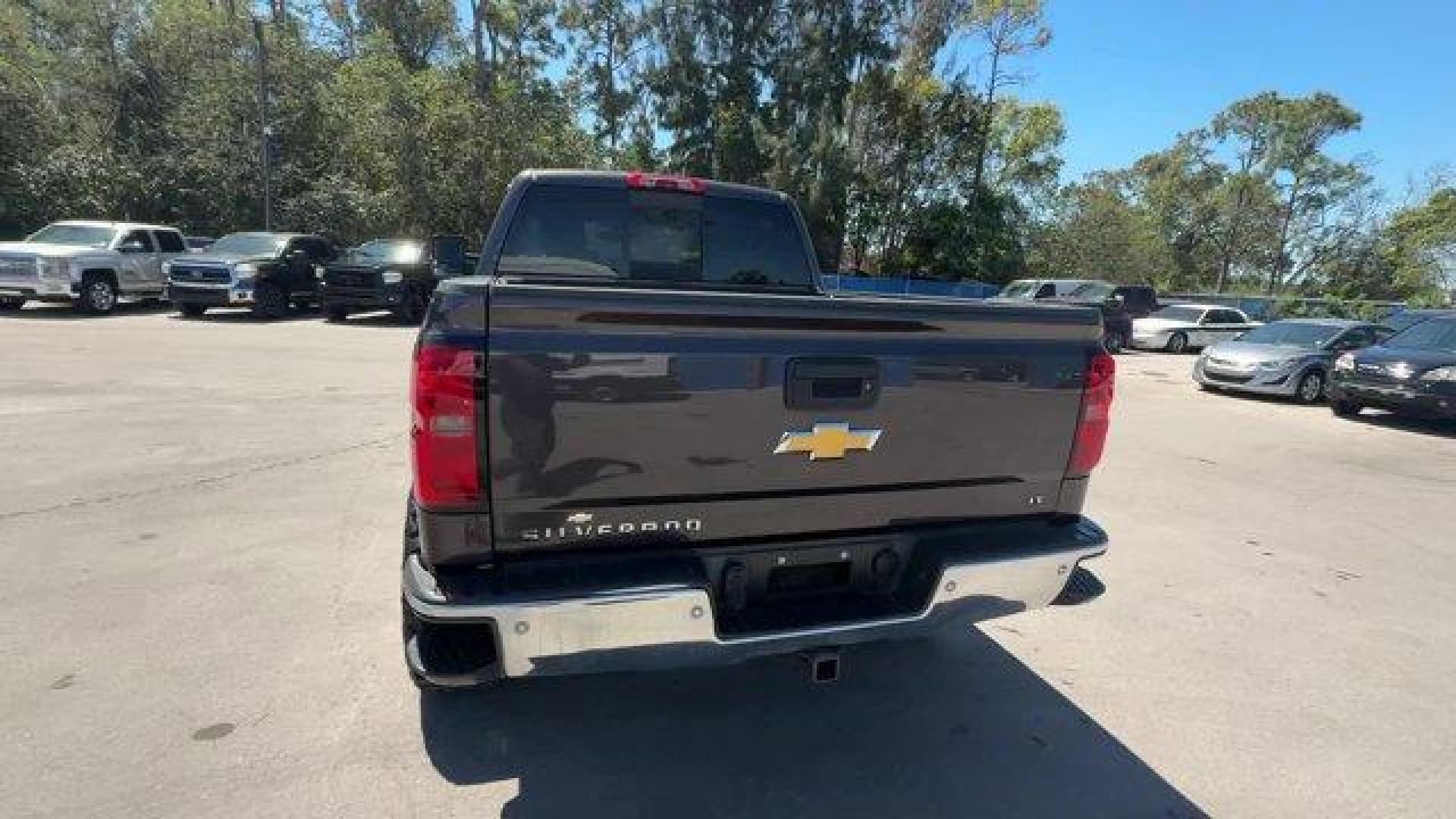 2014 Tungsten Metallic /Jet Black Chevrolet Silverado 1500 LT (3GCUKREC9EG) with an 8 5.3L engine, Automatic transmission, located at 27610 S Dixie Hwy, Homestead, FL, 33032, (305) 749-2348, 25.510241, -80.438301 - NACTOY 2014 North American Truck of the Year. Boasts 22 Highway MPG and 16 City MPG! This Chevrolet Silverado 1500 boasts a Gas/Ethanol V8 5.3L/325 engine powering this Automatic transmission. WINDOW, POWER, REAR SLIDING WITH REAR DEFOGGER, WHEELS, 18 X 8.5 (45.7 CM X 21.6 CM) BRIGHT-MACHINED ALUMIN - Photo#3