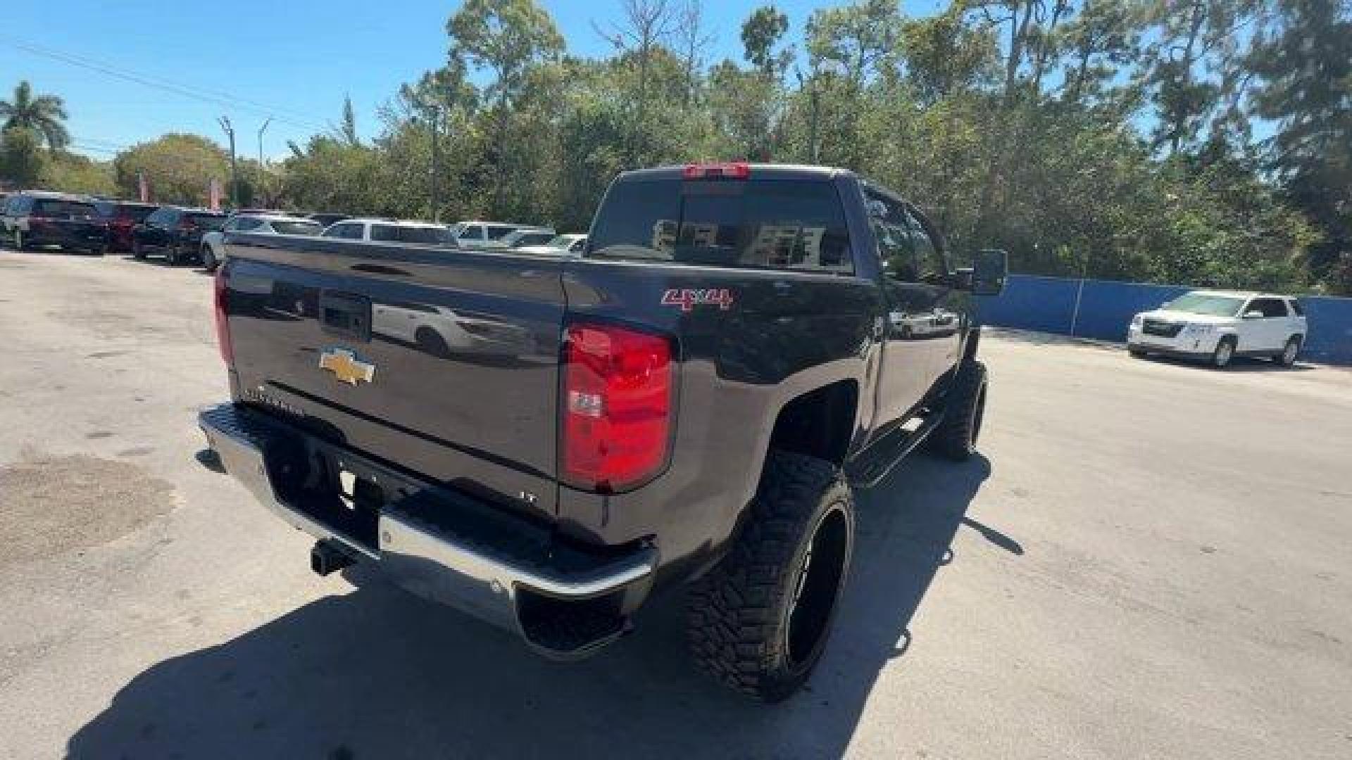 2014 Tungsten Metallic /Jet Black Chevrolet Silverado 1500 LT (3GCUKREC9EG) with an 8 5.3L engine, Automatic transmission, located at 27610 S Dixie Hwy, Homestead, FL, 33032, (305) 749-2348, 25.510241, -80.438301 - NACTOY 2014 North American Truck of the Year. Boasts 22 Highway MPG and 16 City MPG! This Chevrolet Silverado 1500 boasts a Gas/Ethanol V8 5.3L/325 engine powering this Automatic transmission. WINDOW, POWER, REAR SLIDING WITH REAR DEFOGGER, WHEELS, 18 X 8.5 (45.7 CM X 21.6 CM) BRIGHT-MACHINED ALUMIN - Photo#4